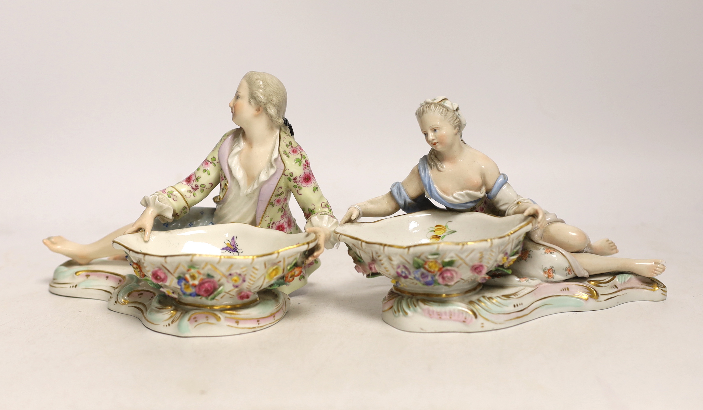 A pair of 19th century Meissen bon-bon figures, incised numbers 2875 and 2872